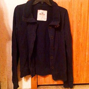 A black button up sweater